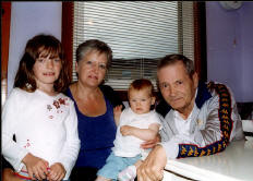 With Rosemary and his Grandchildren Shannon and Kirstin  in July 2004