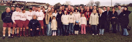 The teams line up at Ladywell Stadium, with members of the Harvey family.