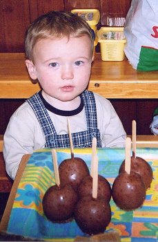 Sticky and tricky: Look what I've found, says Aidan McQuillan, but he waited patiently for the sale to open to buy his toffee apple