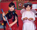 Four year old twins Amy and Rebecca as Babushka and an angel in Cairn Nursery' sChristmas play.