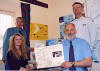 David Killicoat (seated right) shows his family tree to Yvonne Simister, Peter Walker, and Bob Smith (back right)