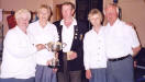 Flo Henderson, Vice president, (left) presents the cup to winnesr John and Helen McConnel, Kirkmichael BC.