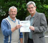 PIC Derek Walker presents two social awards to Peter Mason, right