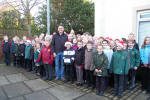 This Morning presenter Steve Wilson with members of Maybole Three Schools Choir.Steve opened the programme saying that he was surprised he had travelled 500 miles (like the Proclaimers?) for a grand opening ceremony but no one seemed to have turned up. Just then the sound of the pipes, played by 12 year old Carrick Academy pupil Scott Barrie, was heard and a crowd of young and old appeared behind the presenter.