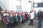 Three schools choir being filmed