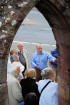 James Brown speaking to pilgrims outside the entrance to the old cemetery at the foot of St Cuthberts Road